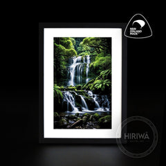 Tiered Falls waterfall artwork with cascading water, moss-covered rocks and lush green forest by Hiriwā Digital Art.